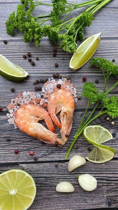 shrimp, limes and spices on a wooden table