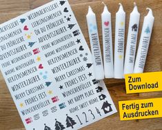 four white candles are next to each other on a wooden table with the words zum, germany and merry christmas written in german