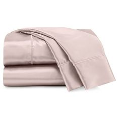 two sheets and one pillow are folded on top of each other, in light pink