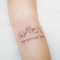 a small wrist tattoo with the words meet me at my happy place