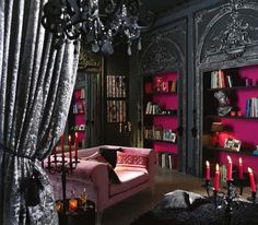 a living room filled with furniture and lots of pink bookshelves next to a window