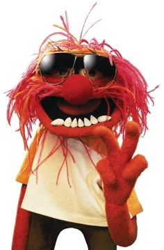 an orange and red animal with sunglasses on it's face