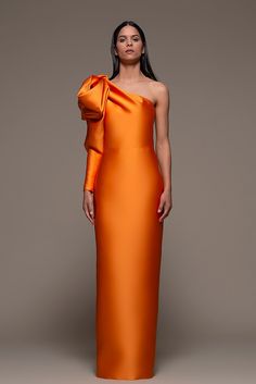 Description Orange Column, Long dress Loose, Long sleeves Open neckline One Sleeve Dry Clean Made in Spain SKU BIENTINA Sheath Gown, Column Skirt, Woman Suit Fashion, Wedding Attire Guest, Column Gown, Column Dress, Bow Knot, Mermaid Fashion, Formal Style