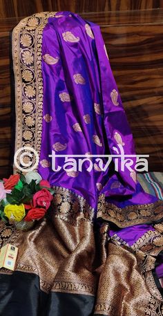 An exquisite Banarasi in spectacular combination of Purple and black with incredible zari work on the elegant paisley motifs on the body, border, and pallu, handwoven on resplendent pure Katan silk. These rustling silks with tapestry-like motifs in their glistening accents are rooted deep in tradition and dipped in regality. The super smooth and soft fabric makes it an absolute delight to drape and carry for occasions like festivals, pujas, celebrations, parties, weddings, etc. A must-have uniqu Traditional Black Dola Silk Lehenga, Black Art Silk Traditional Wear For Wedding, Black Tussar Silk Dupatta For Traditional Ceremonies, Party Jamawar Saree, Black Zari Work Dupatta For Celebration, Party Dupatta With Cutdana In Katan Silk, Party Tussar Silk Dupatta With Pallu, Black Katan Silk Saree For Wedding, Black Dupatta For Celebration With Traditional Drape