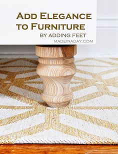 a close up of a wooden table with a sign on it that says, add elegance to furniture by adding feet