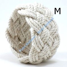 a ball of yarn sitting on top of a white surface