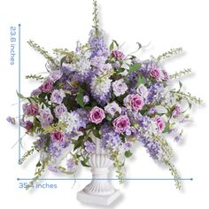 a vase filled with purple and white flowers