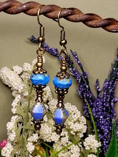 Victorian Blue Drop Earrings are such a beautiful shade of blue, and I am not a blue fan but such a unique shade.I love the variation in the upper bead. Czech Glass beads are such superior quality and so beautiful. Earwires are lead-free and nickle free and hypoallergenic. Gift wrapping is always included with your order. Special orders are welcome. Please stop by my Etsy shop to see over 600 listings of personally designed and hand-made hair accessories and jewelry items. Blue Round Beads Earrings For Jewelry Making, Elegant Blue Czech Glass Earrings, Artistic Blue Czech Glass Jewelry, Blue Czech Glass Drop Earrings, Handmade Blue Round Bead Earrings, Artistic Blue Earrings As Gift, Handmade Artistic Blue Earrings, Artistic Blue Beaded Jewelry, Artistic Blue Nickel-free Jewelry