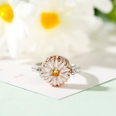 This photo ring is the best choice to make the memory eternal. Fashioned in sleek sterling silver, this ring features a charming daisy, and a shimmering round-cut stone is set at the center to complement the brilliance. With your own photo included, this beautiful piece will be more memorable. You can also wear it as your pendant to make your daisy-themed necklace dangling close to your heart.Carat Weight: 0.81 ctStone Size: 3,1.5,1.3 mmStone Type: Jeulia® StoneNumber of Stones: 28 Stone Shape: RoundStone Color: Citrine Yellow, Diamond WhiteWeight: 4.6 gWidth: 11.4 mmHeight: 5.9 mmThickness: 3.1 mmMaterial: 925 SilverPlating Color: Silver, Rose Gold Photo Ring, Pet Photo, Yellow Diamond, Silver Rose Gold, Photo Jewelry, Citrine, Round Cut, Bespoke, Daisy