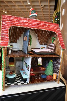 a gingerbread house made to look like it is on display