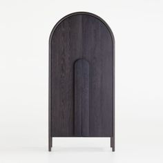 an arch shaped cabinet with a door on one side and a handle on the other