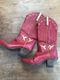 Incredible leather heeled women's vintage cowboy boots, marked '66 West', must be American made.  If there was a size it's now worn away - the sole measures 22cm x 9cm at its widest point. They are 36cm tall including the heel. Vintage Heeled Boots For Fall Rodeo, Vintage Heeled Boots For Rodeo In Fall, Red Heeled Boots For Rodeo, Red Round Toe Heeled Boots For Rodeo, Red Western Heeled Boots With Snip Toe, Vintage Fitted Heeled Boots For Rodeo, Red Western Style Heeled Boots With Round Toe, Red Square Toe Western Boots, Red Western Heeled Boots With Round Toe