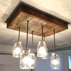 mason jar chandelier hanging from the ceiling