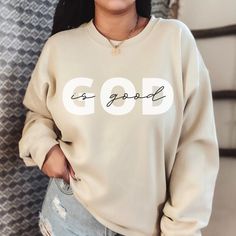 God Is Good Crewneck Saved By Grace Sweatshirt Female Pastor Gift Simple Sweatshirt Christian Sweatshirt Faith Sweatshirts Christian Hoodie Ideal for any situation, a unisex heavy blend crewneck sweatshirt is pure comfort. These garments are made from polyester and cotton. This combination helps designs come out looking fresh and beautiful. The collar is ribbed knit, so it retains its shape even after washing. There are no itchy side seams on these sweaters. .: 50% Cotton 50% Polyester .: Medium Unisex Sweatshirt Designs, Sweatshirt Style Women, Christian Clothing For Women, Christian Crew Neck Sweatshirt, Cute Clothes Sweatshirts & Hoodies, Cute Simple Sweatshirts, God Is Good Sweatshirt, God Is Good Shirt, God T Shirts