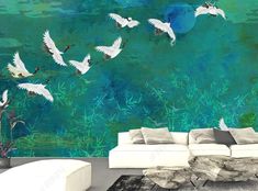 a living room filled with white furniture and lots of birds flying over the ocean floor