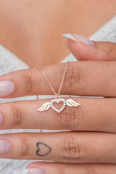 White Zircon Stone Angel Wing Heart Silver Necklace ♥ ✔️Metal Used: 925 Sterling Silver ✔️Weight : 1,70 Gr ✔️Figure Width: 2,30 Cm ✔️Figure Height: 1,00 Cm ✔️Chain Length : 42 Cm ✔️Stone Type : Zircon  ✔️Coating : Rose Gold Plated ⚠️Care: It does not darken as long as contact with substances such as Perfume, Water, Alcohol, Cream, Bleach is avoided. -NRZ998657 Rose Gold Sterling Silver Necklace With Heart Charm, Rose Gold Sterling Silver Heart Charm Necklace, Sterling Silver Rose Gold Necklace With Heart Charm, Dainty Rose Gold Sterling Silver Heart Necklace, Dainty Rose Gold Heart Necklace In Sterling Silver, Rose Gold Sterling Silver Open Heart Necklace, Valentine's Day Rose Gold Sterling Silver Charm Necklace, Rose Gold Sterling Silver Open Heart Charm Necklace, Open Heart Rose Gold Sterling Silver Charm Necklace