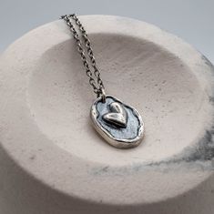 "Handmade sterling silver heart pendant necklace with an organic look. The pendant dimensions are 19 mm X 14 mm /0.74\" X 0.55\". The necklace goes with a sterling silver chain, please choose the length from the drop-down menu. It comes gift wrapped and ready for giving! ✿REGISTERED MAIL WITH TRACKING NUMBER ✿All of our jewelry are made to order. ✿ keep in mind that the final product might deviate slightly from the pictured product. ✿For more handmade jewelry visit our shop : http://www.etsy.com Heart-shaped Oxidized Sterling Silver Necklaces, Heart-shaped Sterling Silver Necklace With Oxidized Finish, Heart Shaped Sterling Silver Necklace With Oxidized Finish, Heart Pendant Necklace With Oxidized Finish For Gift, Heart Shaped Oxidized Necklace Perfect As A Gift, Wedding Ring Necklaces, Sterling Silver Heart Pendant, Jewelry Heart, Pendant Heart