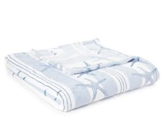 a blue and white blanket with starfishs on it