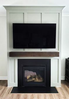 a fireplace with a flat screen tv above it