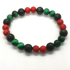 Red, Black And Green Bracelet Casual Multicolor Bracelets, Casual Red Stretch Bracelet As Gift, Casual Red Stretch Bracelet As A Gift, Casual Red Stretch Bracelet For Gift, Adjustable Red Stretch Bracelet Casual Style, Casual Black Stretch Bracelet As A Gift, Casual Black Stretch Bracelet As Gift, Casual Black Stretch Bracelet For Gift, Casual Black Stretch Bracelet