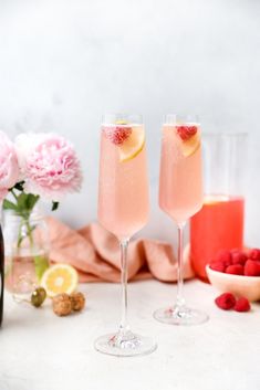 two champagne flutes filled with raspberry lemonade