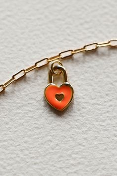 Gold filled enamel Orange padlock heart charm is lovey and happy. Add some joy to your charm necklace with this pop of color. Hand make your custom charm necklace in Laguna Beach or build your piece online through adding a base necklace and your selection of charms. Leave us a note on your order for any special requests. Gold filled Tarnish resistant Enamel Custom Charm Necklaces, Custom Charms, Ceramic Gifts, Candle Collection, Laguna Beach, Gold Filled Jewelry, Jewelry Party, Ring Necklace, Heart Charm