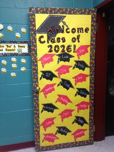 a bulletin board decorated with graduation caps and diplomas