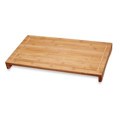 a wooden cutting board on a white background