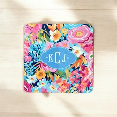 a colorful floral coaster with the letter kl on it