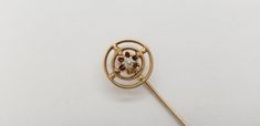 Up for sale is this Very Nice Antique Edwardian 10K Yellow Gold Diamond Stick Pin. Circa 1900's-1910's. Marked '10K'. Measures 2 1/4" long. The diamond measures 2mm in diameter. No chips or cracks. The diamond is firmly secure. Weighs 1 gram. Overall excellent condition. Free S&H. See my other pieces of fine estate jewelry up for sale on Etsy. Fresh from a private estate. Satisfaction 100% Guaranteed. See my other Etsy store SalisburysAntiques2 and my Ebay auction site Salisbur. https://www.etsy.com/shop/SalisburysAntiques2 https://www.ebay.com/sch/m.html?_ipg=50&_ssn=salisbur&_sop=1 Victorian 14k Gold Brooches For Formal Occasions, Victorian 14k Gold Brooch For Formal Wear, Antique Style 14k Gold Brooches For Formal Occasions, Antique Style 14k Gold Brooch For Formal Occasions, Vintage Formal Brooches With Screw Back, Vintage Screw Back Brooches For Formal Occasions, Vintage Hallmarked 14k Gold Brooches, Vintage 14k Yellow Gold Brooches, Vintage Filigree Brooches For Formal Occasions