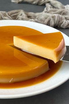 a white plate topped with cheese and caramel sauce