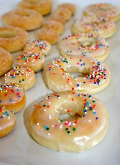 there are many doughnuts with sprinkles on them