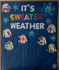 a bulletin board with sweaters and snowflakes on it