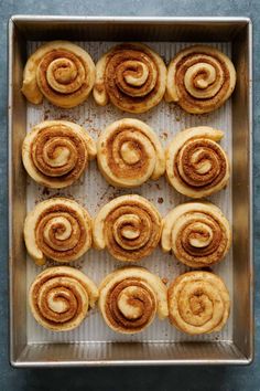 cinnamon buns on a baking sheet ready to be baked in the oven for breakfast