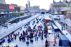 many people are skating on an icy river