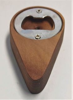 a wooden and metal object sitting on top of a table