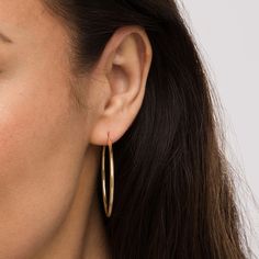 Achieve an effortless yet chic look with these classic 14K gold hoop earrings - a must-have fashion staple for your growing jewelry collection. Created in 14K gold Each earring showcases a simple yet bold 40.0mm-wide tubular hoop. These earrings secure with latch backs. Classic 14k Gold Filled Hoop Earrings For Everyday Luxury, Classic Rose Gold Hoop Earrings, Minimalist 14k Gold Hoop Earrings For Formal Occasions, Minimalist 14k Gold Hoop Earrings For Formal Events, Modern 14k Gold Hoop Earrings, Minimalist Hypoallergenic Yellow Gold Hoop Earrings, Formal Minimalist 14k Gold Hoop Earrings, Timeless Hypoallergenic Hoop Earrings For Everyday, Sleek 14k Gold Jewelry