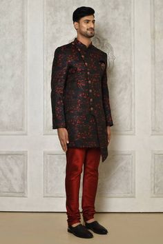 Multi color asymmetric hem sherwani with all over floral branch pattern. Paired with a dark red churidar.
Components: 2
Pattern: Woven
Type Of Work: Floral Branch
Neckline: Stand Collar
Sleeve Type: Full Sleeves
Fabric: Sherwani: Jaquard, Churidar: Dupion Art Silk
Color: Multi Color
Other Details: 
Closure: Front buttons
Embellished brooch detailing
Note: Pocket square worn by the model is not for sale
Occasion: Sangeet - Aza Fashions Designer Long Sleeve Floral Print Sherwani, Designer Floral Print Long Sleeve Sherwani, Fitted Floral Print Bandhgala For Festive Occasions, Festive Floral Print Fitted Bandhgala, Festive Fitted Floral Print Bandhgala, Designer Brocade Bandhgala For Festive Occasions, Traditional Formal Sets With Floral Print, Traditional Floral Print Formal Set, Designer Traditional Bandhgala With Floral Print