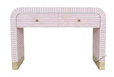 a pink and white striped desk with two drawers