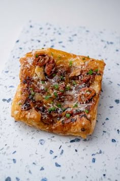 a piece of food sitting on top of a table