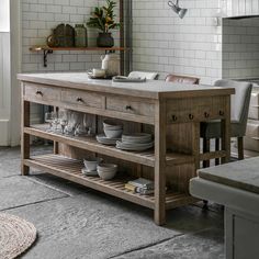 a kitchen island with plates and bowls on it