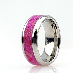 Titanium Cremation Ring inlaid with Opal # 09 - Magenta. https://cremationjewelers.com/ Crushed Opal offers a unique addition to pet memorial jewelry, allowing you to keep your beloved four-legged loved one close to you. All Cremation Jewelry, Memorial Jewelry, Ash Rings, Cremate Rings, Pendants and Urn Jewelry made with 2-legged (human) loved one's ashes, must be ordered directly from my personal site due to Etsy policies, see www.CremationCreations.net RING WIDTH SIZES AVAILABLE: 4 mm, 6 mm, a Pink Ring With Polished Finish, Formal Rings With Inlay, Pink Wedding Rings With Polished Finish, Cremation Ring, Ashes Ring, Pet Memorial Jewelry, Jewelry Opal, Urn Jewelry, Crushed Stone