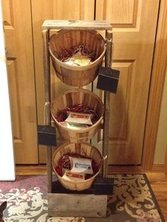 three wooden baskets stacked on top of each other