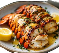 cooked lobsters with lemon and parsley on a plate