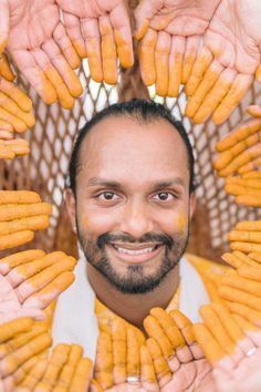 a man is surrounded by many small pieces of food that are arranged in the shape of a circle