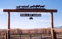 there is a sign that says fish at the ranch with horses on top and below it