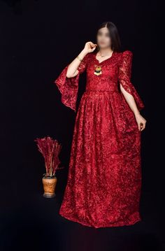 This stunning wine red Kurdish dress, featuring intricate floral embroidery and shimmering sequins, is the perfect choice for weddings, cultural events, and formal gatherings. The dress is designed with a flattering silhouette and detailed craftsmanship, showcasing the beauty of traditional Kurdish attire with a modern twist. The lace sleeves and delicate embellishments add an extra touch of elegance. *Material: Chiffon with sequins and floral embroidery *Size: Available in small size  *Care Ins Traditional Red Maxi Dress For Wedding, Floor-length Red Dress For Eid, Red Floor-length Dresses For Eid, Traditional V-neck Embroidered Wedding Dress, Red Maxi Dress For Eid, Festive V-neck Wedding Dress, Red Anarkali Dress For Eid, Formal Floor-length Evening Dress For Eid, Party Evening Dress With Resham Embroidery