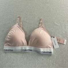 Calvin Klein Lightly Lined Women’s Triangle Bralette Back Closure New With Tag Never Worn, For Better Details Please Refered To The. Pictures. Photos Are Of Exact Bralette Being Sold I Ship Daily Or Next Day Smoke And Pets Free Home -Back Closure -Removable Pads -Adjustable Straps -Lightly Lined -2vay Convertible Straps Size: Xl Color: Pink And White Thank You For Visiting My Closet, Have A Safe And Happy Day. I Do Accept Reasonable Offers Bundle And Save On Shipping Soft Touch Bra For Summer Loungewear, Spring Underwire Bra For Loungewear, Spring Loungewear Underwire Bra, Spring Padded Bras, Cotton Bra With Padded Cups, Calvin Klein Seamless Spring Bra, Calvin Klein Fitted Bra For Summer, Fitted Calvin Klein Bra For Summer, Fitted Calvin Klein Summer Bra