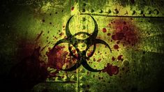 the biohazard symbol is shown in red and green paint on an old wall