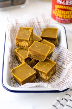 several pieces of peanut butter fudge sitting on top of a paper towel in a bowl